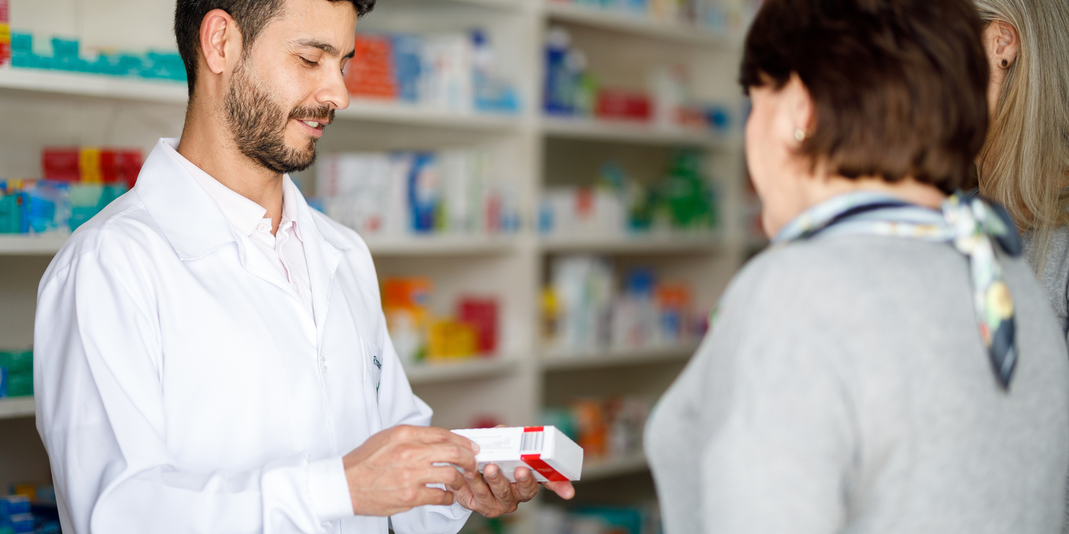 pharmacist with clients